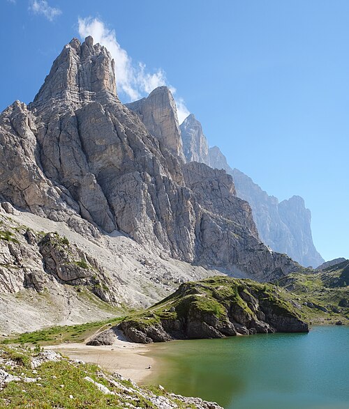Lake Coldai, an alpine lake beneath the Dolomites near village Alleghe, Italy